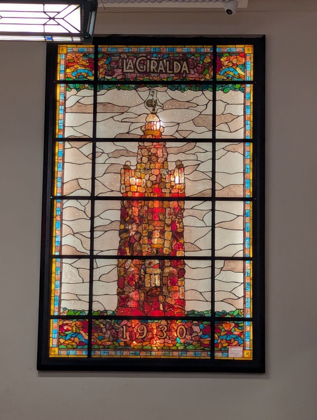 Neon sign promoting cocoa beverage with pastry (chocolate con churros) atCABA